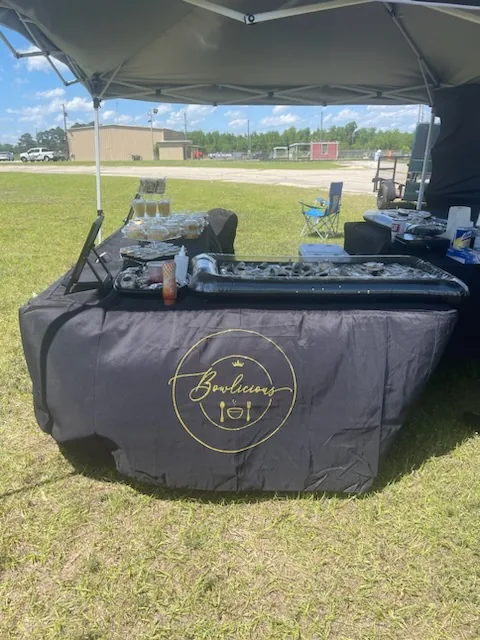 Bowlicious Eats pop-up tent and table setup